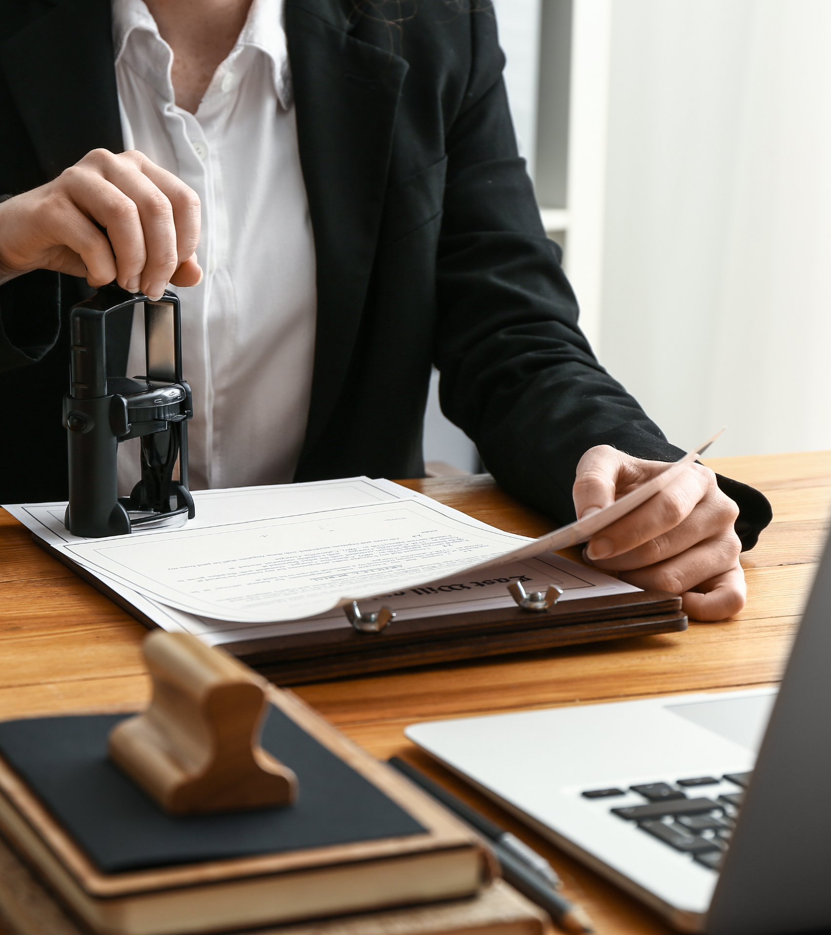 woman stamping documents